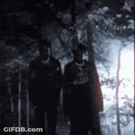 Two People In Dark, One Shirt Saying A GIF