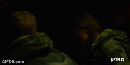 Two People In Dark Room With Netflix Logo GIF