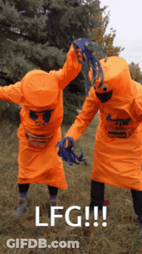 Two People In Orange Costumes With The Word Lfg On The Bottom Right GIF