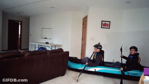 Two People In Tobin Inflatable Kayak In Living Room GIF
