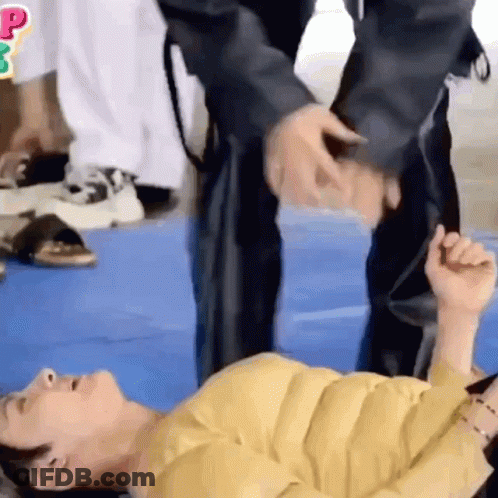 Two People On Blue Mat Hand Over Head GIF