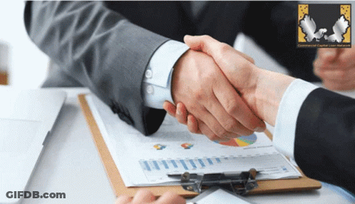 Two People Shaking Hands With Community Capital Loan Association Clipboard GIF