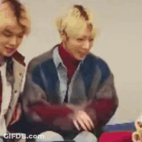 Two People Sitting On A Couch Blurry GIF
