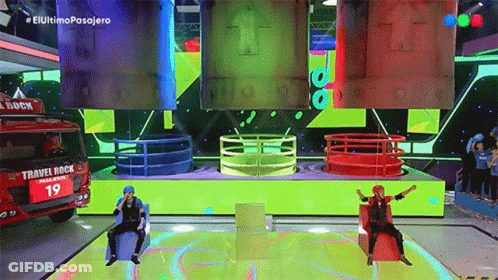 Two People Sitting On Stage With Travel Rock Truck GIF