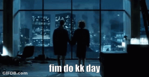 Two People Standing In Front Of A Large Window With The Words " Fim Do Kk Day " On The Bottom GIF