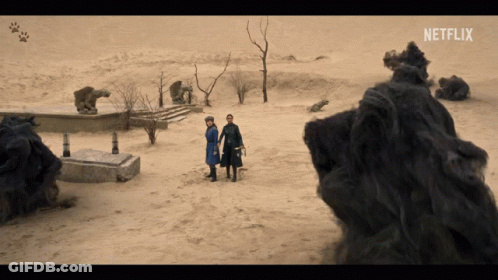 Two People Standing In The Desert With Netflix Written On The Bottom GIF
