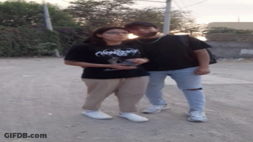 Two People Standing Next To Each Other GIF