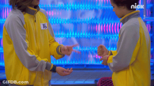 Two People Standing Together One In Yellow Jacket Number 16 GIF