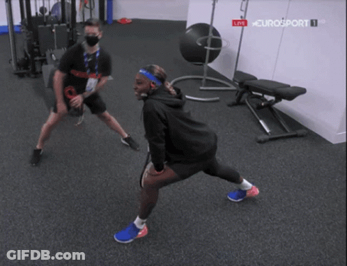 Two People Stretching In Gym GIF