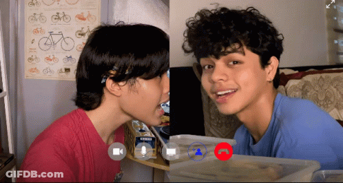 Two People Video Call One Wearing Blue Crews Shirt GIF