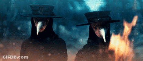 Two People Wearing Masks And Hats GIF