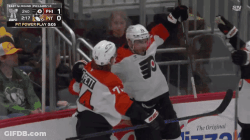 Two Philadelphia Flyers Hockey Players Celebrate A Goal GIF