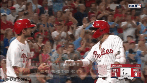 Two Phillies Players Shake Hands During A Game GIF