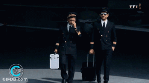 Two Pilots Walking In Front Of An Airplane With A Tfi Logo GIF