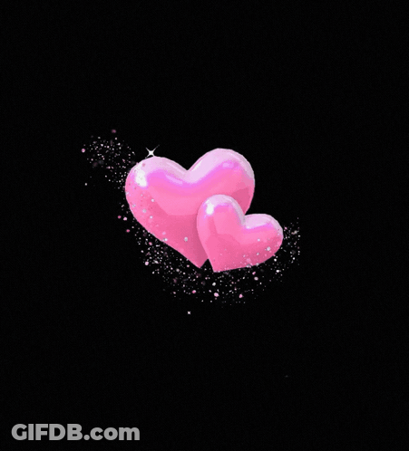 Two Pink Hearts Surrounded By Circle Of Lights GIF