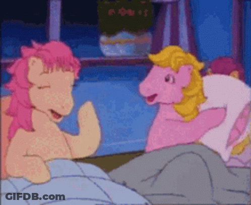 Two Pink Ponies Are Talking To Each Other In A Bedroom GIF