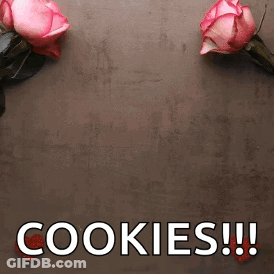 Two Pink Roses Are Sitting On A Table Next To The Words Cookies GIF