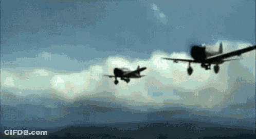 Two Planes Flying In Cloudy Sky GIF