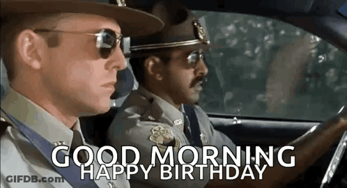 Two Police Officers Are Driving A Car And The Words `` Good Morning Happy Birthday '' Are On The Screen . GIF