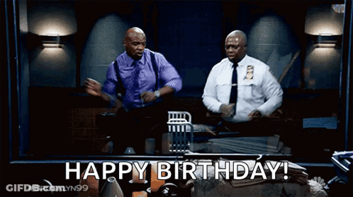 Two Police Officers Dancing In Front Of Happy Birthday Screen GIF