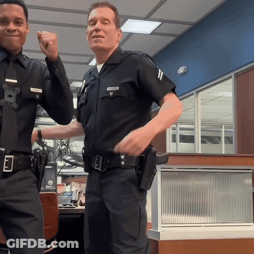 Two Police Officers One With Smith Name Tag GIF