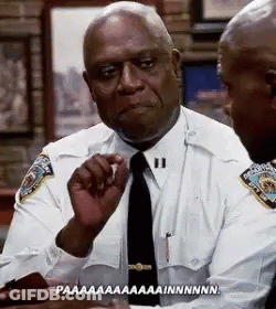Two Police Officers Sitting At Table GIF
