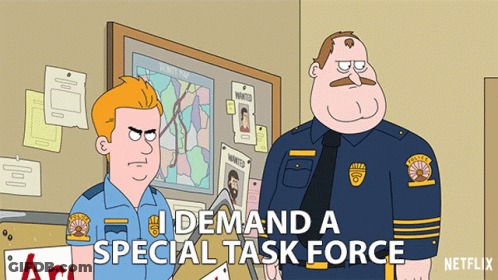 Two Police Officers Standing In Front Of Bulletin Board Saying I Demand A Special Task Force GIF
