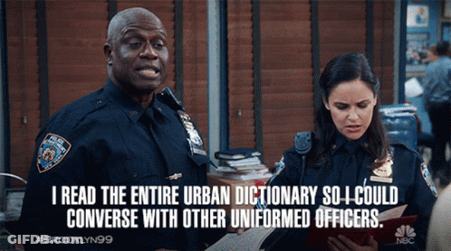 Two Police Officers Standing Next To Each Other With A Caption That Says I Read GIF