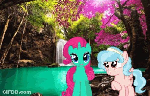 Two Ponies Are Standing In Front Of A Waterfall In A Forest GIF