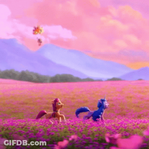 Two Ponies Are Walking Through A Field Of Purple Flowers . GIF