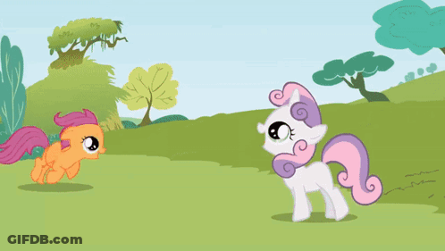 Two Ponies Standing In Grassy Area GIF