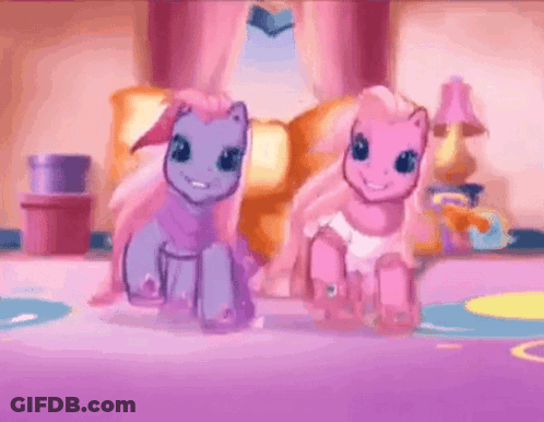 Two Ponies Standing Next To Each Other In Living Room GIF