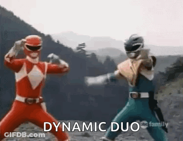 Two Power Rangers Are Standing Next To Each Other In A Dynamic Duo Pose . GIF