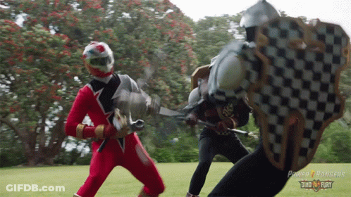 Two Power Rangers Fighting With Swords And Shields GIF