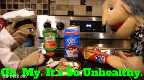 Two Puppets Are Cooking In Front Of A Stove With The Words " Oh My It 'S So Unhealthy " On The Bottom GIF