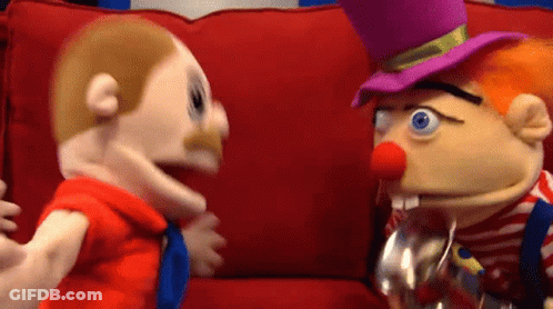 Two Puppets Are Sitting On A Red Couch And One Has A Top Hat On GIF