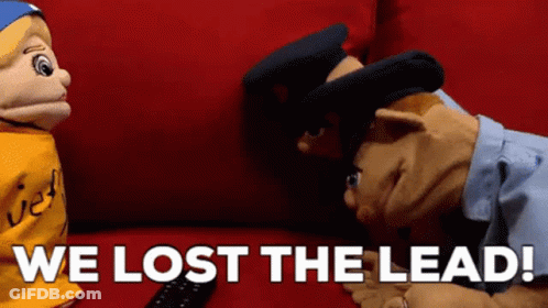 Two Puppets On Red Couch We Lost The Lead GIF
