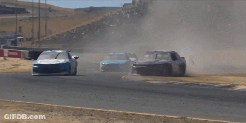 Two Race Cars Are Going Down A Track And One Has The Number 1 On The Front Of It GIF