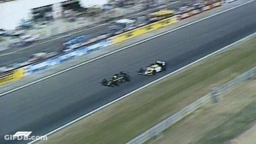 Two Race Cars On Track With Letter F GIF