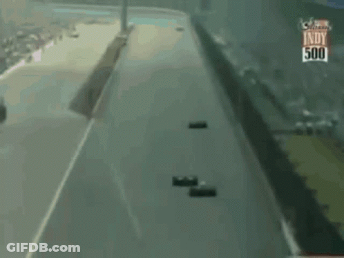 Two Race Cars Racing On Track GIF