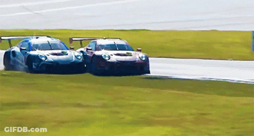 Two Race Cars Racing One With Yellow Sticker GIF