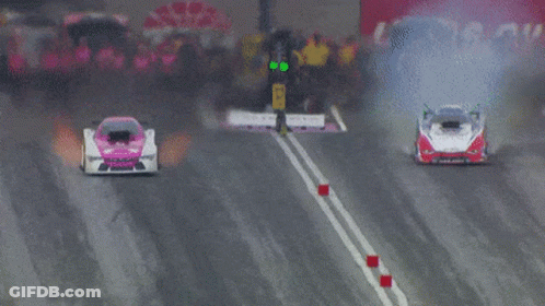 Two Racing Cars, One With Number 11 GIF