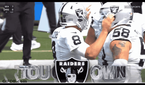 Two Raiders Football Players On Field GIF