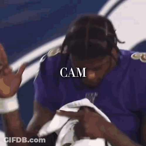 Two Ravens Football Players Hugging GIF