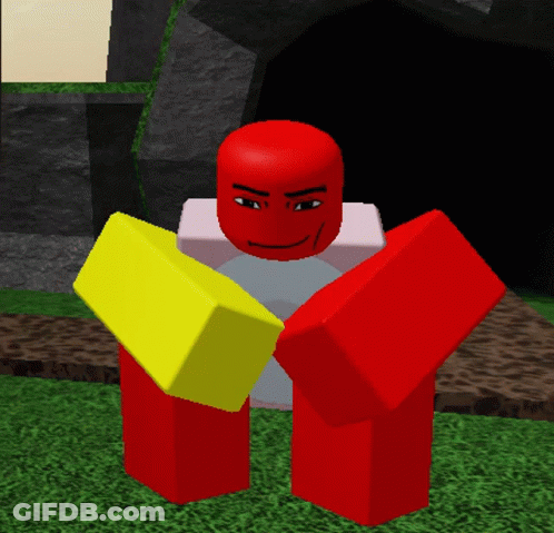 Two Red And Yellow Blocks Are Standing Next To Each Other On A Grassy Field GIF
