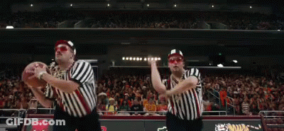 Two Referees Holding Basketball On Court GIF