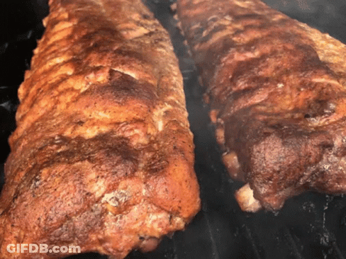 Two Ribs Cooking On Grill With Smoke GIF