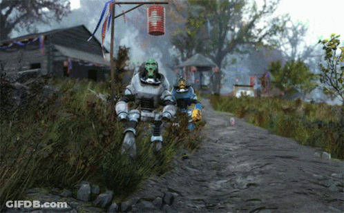 Two Robots Are Walking Down A Dirt Road With A Red Lantern In The Background GIF