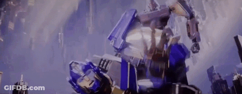 Two Robots Fighting In A City GIF