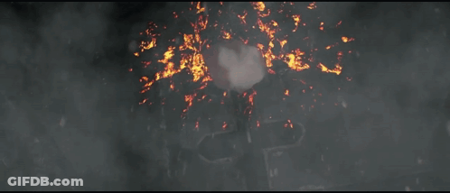 Two Robots Fighting In Dark Room With Red Smoke GIF